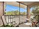 Private screened in porch with tranquil view of landscaped grounds and parking at 5636 Baywater Dr # 5636, Tampa, FL 33615
