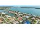 Breathtaking aerial view of a waterfront community with numerous canals, homes, and the open bay in the distance at 6129 Leeland S St, St Petersburg, FL 33715