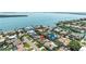 Picturesque aerial view of a waterfront community featuring beautiful homes and stunning bay access with boat docks at 6129 Leeland S St, St Petersburg, FL 33715