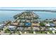 Breathtaking aerial view of upscale homes on waterfront properties with lush landscaping at 6129 Leeland S St, St Petersburg, FL 33715