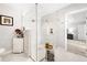 Bathroom with a glass walk-in shower featuring decorative tile and a rain shower head at 6129 Leeland S St, St Petersburg, FL 33715