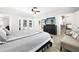 Open bedroom with a view to the pool, and a walk-in closet with custom shelving at 6129 Leeland S St, St Petersburg, FL 33715