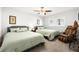 Comfortable bedroom featuring two beds, neutral decor and a massage chair at 6129 Leeland S St, St Petersburg, FL 33715