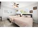 Bright bedroom with wood flooring, plantation shutters, and dual beds at 6129 Leeland S St, St Petersburg, FL 33715
