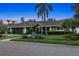 Charming single-story home with a well-manicured lawn, mature trees, and a two-car garage at 6129 Leeland S St, St Petersburg, FL 33715