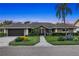 Charming single-story home boasts lush landscaping, a two-car garage, and a welcoming front entrance at 6129 Leeland S St, St Petersburg, FL 33715