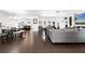 Open-concept living area showcases an expansive layout with wood-look tile flooring and a seamless flow at 6129 Leeland S St, St Petersburg, FL 33715