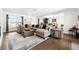 Bright living room showcasing a large sectional sofa, area rug, and elegant decor at 6129 Leeland S St, St Petersburg, FL 33715