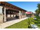 Entertainer's dream featuring a covered outdoor bar, ample seating, and a manicured lawn for games and gatherings at 6129 Leeland S St, St Petersburg, FL 33715