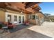 Relax in style on this covered patio, offering comfortable seating and travertine flooring for an elegant outdoor experience at 6129 Leeland S St, St Petersburg, FL 33715