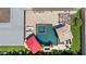Aerial image of a luxurious pool and patio area with lounge chairs and umbrellas for relaxing outdoor living at 6129 Leeland S St, St Petersburg, FL 33715