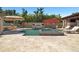 Dive into luxury with this home's sparkling pool, complete with spa, lush landscaping, and a cozy firepit area at 6129 Leeland S St, St Petersburg, FL 33715
