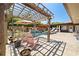 Outdoor oasis featuring a refreshing pool, comfortable lounge chairs, and a charming wooden pergola at 6129 Leeland S St, St Petersburg, FL 33715