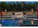 Backyard pool and spa with a water feature and lush landscaping offering a private tropical oasis at 6129 Leeland S St, St Petersburg, FL 33715