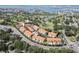 An aerial view shows the orange roofed properties, golf course, and the beautiful waterfront at 6303 Vista Verde E Dr, Gulfport, FL 33707