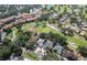 Scenic aerial highlights a residential neighborhood adjacent to a golf course, offering beautiful views and recreation at 6303 Vista Verde E Dr, Gulfport, FL 33707