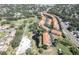 Breathtaking aerial showcases the community layout, mature trees, and proximity to the neighboring golf course at 6303 Vista Verde E Dr, Gulfport, FL 33707