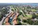 This aerial showcases a community close to a golf course and waterfront, blending residential comfort with recreational opportunities at 6303 Vista Verde E Dr, Gulfport, FL 33707