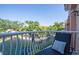 Relaxing balcony view of lush landscaping and a serene waterway, providing a peaceful retreat at 6303 Vista Verde E Dr, Gulfport, FL 33707