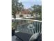 Relaxing balcony view overlooking a serene pond with a fountain and neighboring townhomes at 6303 Vista Verde E Dr, Gulfport, FL 33707