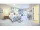 Bright bedroom featuring a soft color palette, beach-themed decor, and access to additional rooms at 6303 Vista Verde E Dr, Gulfport, FL 33707