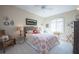 Charming bedroom with patterned bedspread, comfy seating, and bright window offering a serene retreat at 6303 Vista Verde E Dr, Gulfport, FL 33707