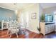 Bright dining area with stylish decor and a view to the backyard through shuttered glass doors at 6303 Vista Verde E Dr, Gulfport, FL 33707