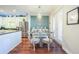Dining area with a kitchen view, and a modern chandelier fixture at 6303 Vista Verde E Dr, Gulfport, FL 33707