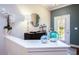 Inviting entryway with stylish decor, including a modern mirror and decorative vases at 6303 Vista Verde E Dr, Gulfport, FL 33707