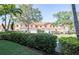 Townhome exterior showcasing a row of homes with well-manicured landscaping and waterfront views at 6303 Vista Verde E Dr, Gulfport, FL 33707