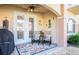 Covered lanai featuring outdoor seating, ceiling fan, grill, and a view of the community at 6303 Vista Verde E Dr, Gulfport, FL 33707