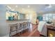Stylish living area with counter seating, hardwood floors, and plenty of natural light at 6303 Vista Verde E Dr, Gulfport, FL 33707