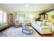 Cozy living room with a plush rug, comfortable seating, and an abundance of natural light at 6303 Vista Verde E Dr, Gulfport, FL 33707