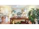 Inviting living space with decorative accents, plantation shutters, and hardwood floors at 6303 Vista Verde E Dr, Gulfport, FL 33707