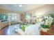 Bright living room featuring large windows, comfortable seating, and elegant decor at 6303 Vista Verde E Dr, Gulfport, FL 33707