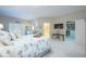 Spacious main bedroom featuring a large bed, walk-in closet, and open doorway to main bath at 6303 Vista Verde E Dr, Gulfport, FL 33707