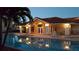 Community pool and clubhouse illuminated at dusk for evening enjoyment at 6303 Vista Verde E Dr, Gulfport, FL 33707
