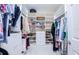 Spacious walk-in closet with custom shelving, drawers, and storage for efficient organization and style at 6303 Vista Verde E Dr, Gulfport, FL 33707