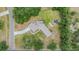 Aerial view of a house showing the unique architecture and surrounding lush landscaping at 6702 Towhe Dr, Seffner, FL 33584