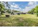 Large backyard featuring a playground, shed, and plenty of open space, great for recreation and outdoor activities at 6702 Towhe Dr, Seffner, FL 33584