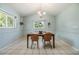 Dining area with wainscoting and a charming chandelier at 6702 Towhe Dr, Seffner, FL 33584