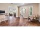Cozy office space featuring hardwood floors and views into the living room at 6702 Towhe Dr, Seffner, FL 33584