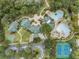 Overhead shot showcasing the community center with amenities including pools and tennis courts at 7815 Blue Spring Dr, Land O Lakes, FL 34637