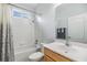 Bright bathroom featuring a shower over tub and updated vanity at 7815 Blue Spring Dr, Land O Lakes, FL 34637