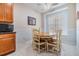 Dining area with table and chairs next to a window with blinds at 7815 Blue Spring Dr, Land O Lakes, FL 34637