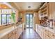 Well-appointed kitchen with custom cabinets, modern appliances, and a convenient pass-through window at 7815 Blue Spring Dr, Land O Lakes, FL 34637