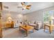 Upstairs living room with ceiling fan, neutral paint, and carpet flooring at 7815 Blue Spring Dr, Land O Lakes, FL 34637