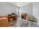 Bright and airy office space with hardwood floors, desk, cabinets, and a window with natural light at 7815 Blue Spring Dr, Land O Lakes, FL 34637