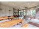 Community pavilion with picnic tables, a kitchen area, and large windows showcasing the natural surroundings at 7815 Blue Spring Dr, Land O Lakes, FL 34637