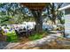 Backyard featuring a tree house with a ladder, an outdoor seating area and a mural wall at 905 E Hanna Ave, Tampa, FL 33604